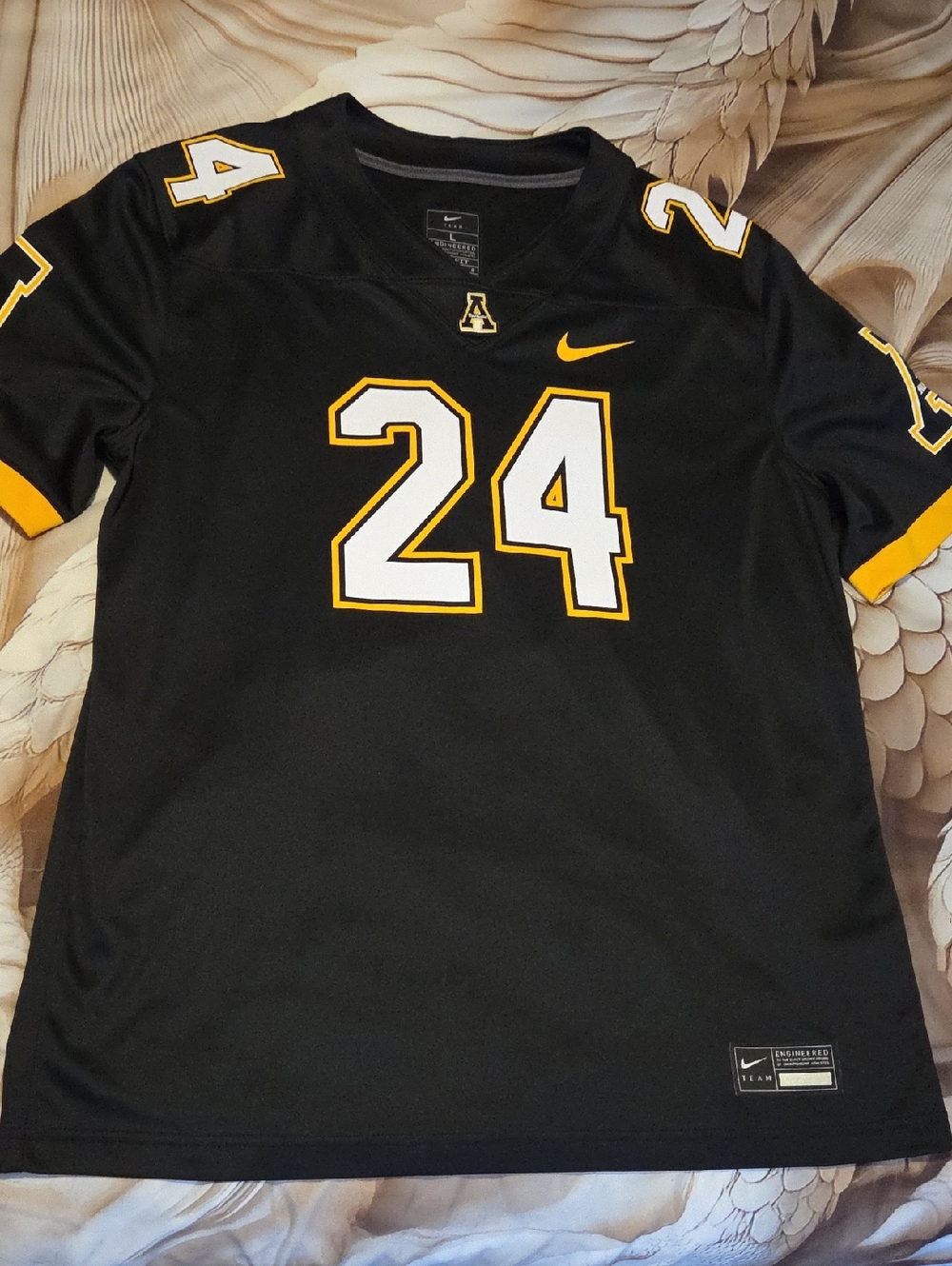 Nike Black Men's Football Jersey with Gold Accents and Number 24
